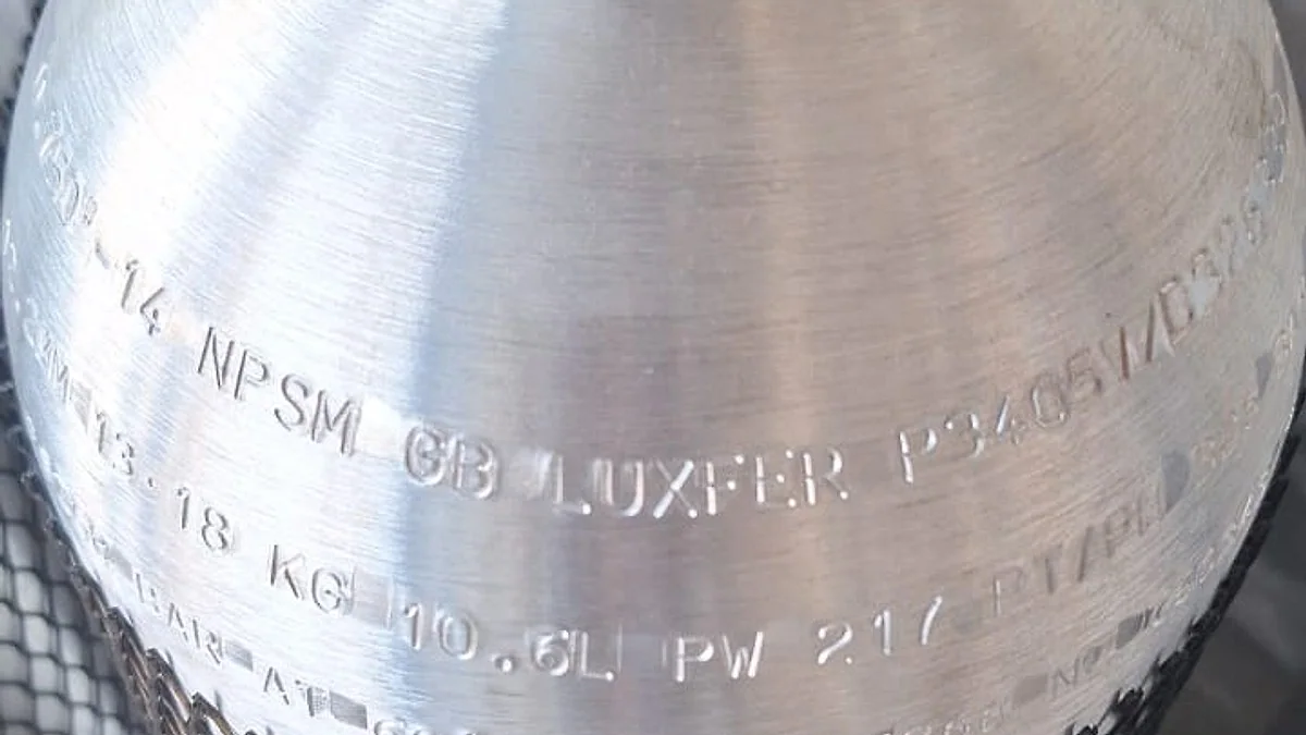 The shoulder stamp of a new Luxfer aluminium dive cylinder