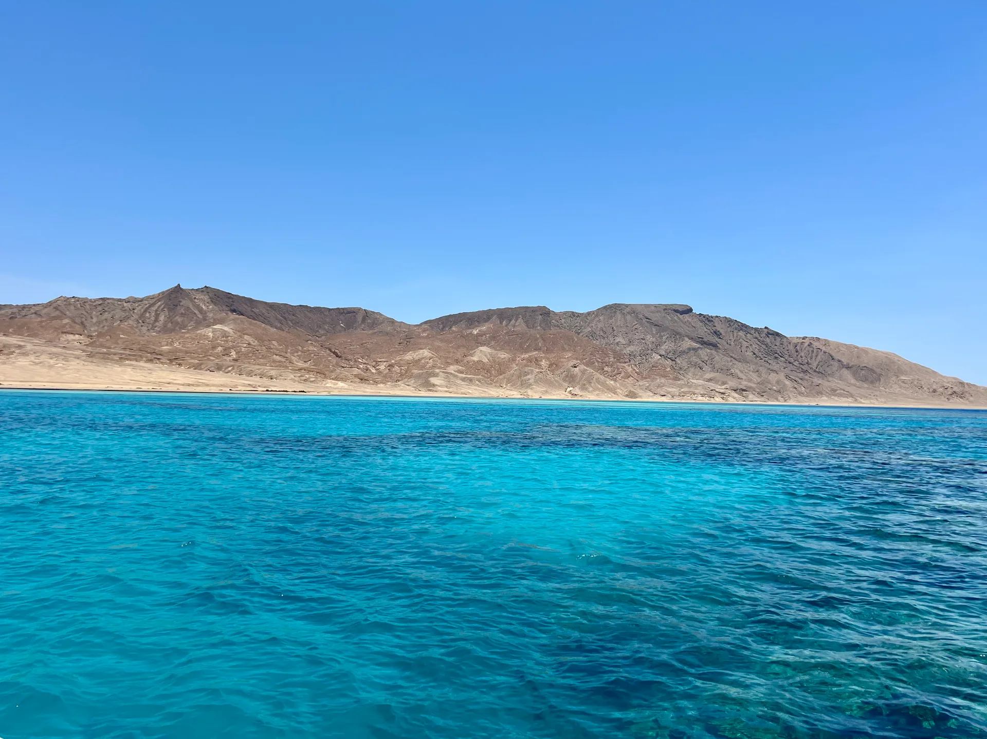 The mountainous ridge of Shedwan Island seen from the water