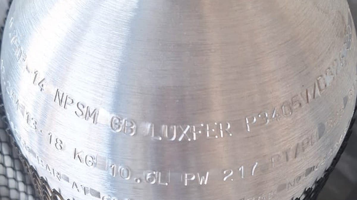 The shoulder stamp of a new Luxfer aluminium dive cylinder